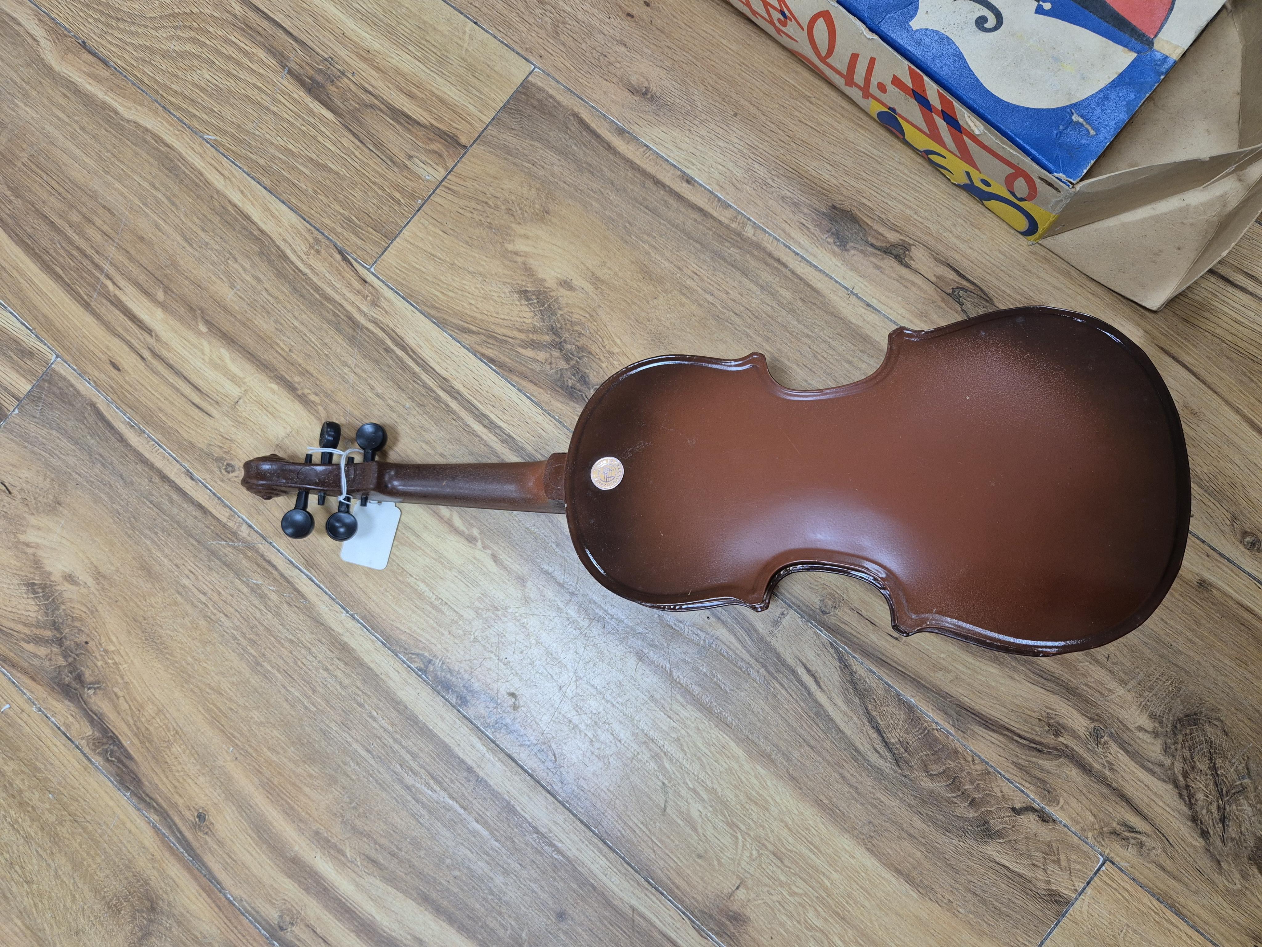 A quantity of violin parts and violins, a ukelele, a double bass scroll, a pinfold metronome, a violin case by Hill, a viola etc. Condition - for restoration